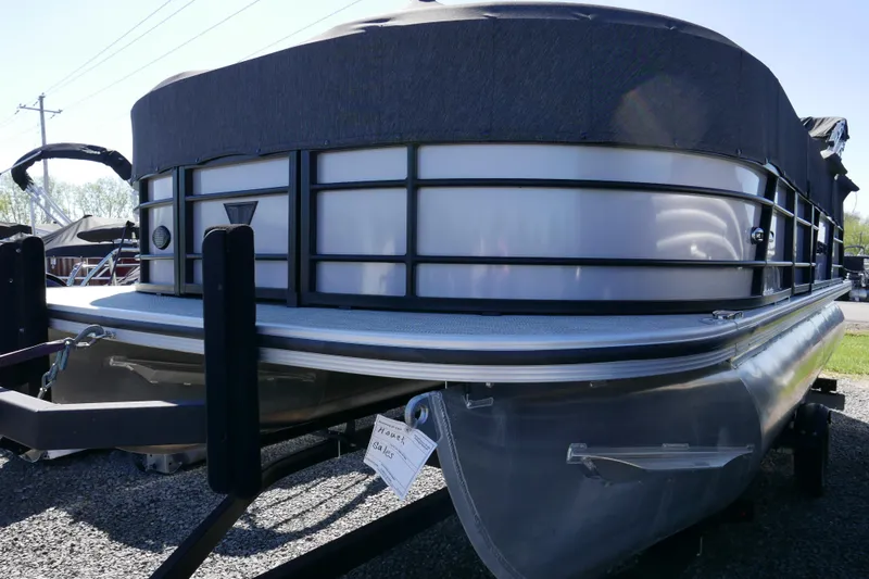 Slide: The Image of 2023 Trifecta C Series pontoon boat on trailer, covered and ready for transport. - 15