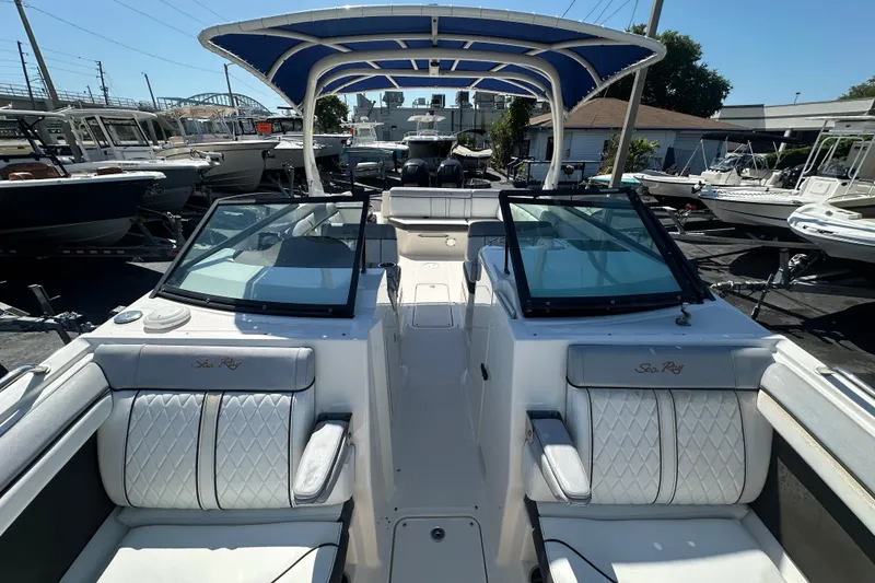 Slide: The Image of 2017 Sea Ray SDX 290 Outboard boat with dual windshields and luxurious seating. - 10