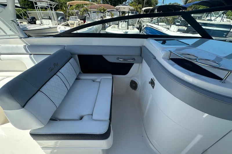 Slide: The Image of 2017 Sea Ray SDX 290 Outboard interior with seating and cup holders. - 14