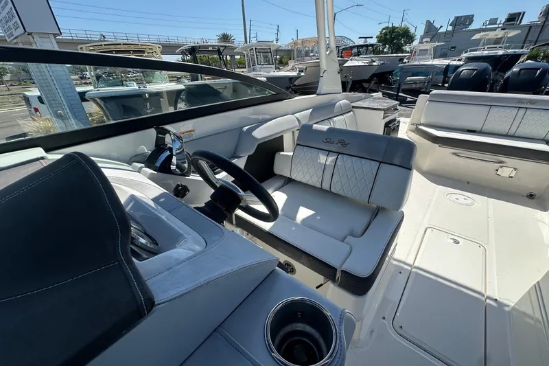 Slide: The Image of 2017 Sea Ray SDX 290 Outboard boat interior with steering wheel and seating. - 15