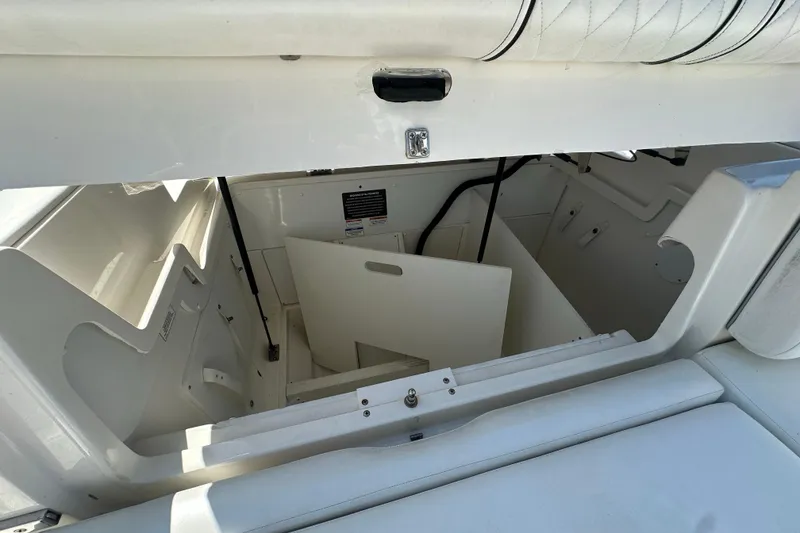 Slide: The Image of Open storage compartment in 2017 Sea Ray SDX 290 Outboard boat. - 25
