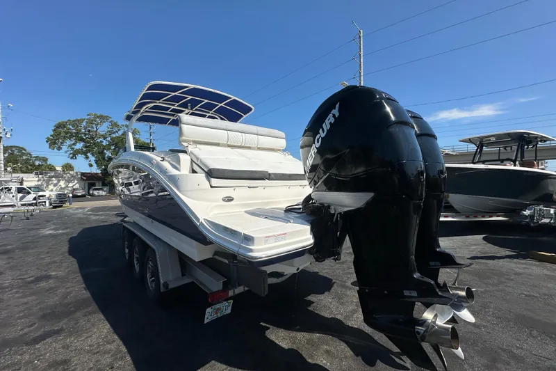 Slide: The Image of 2017 Sea Ray SDX 290 Outboard boat with twin Mercury engines on a trailer. - 3