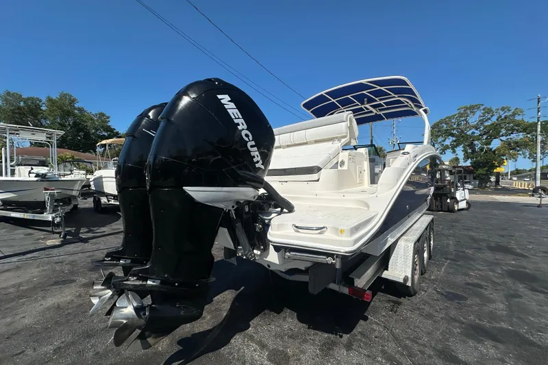 Slide: The Image of 2017 Sea Ray SDX 290 Outboard boat with twin Mercury engines on a trailer. - 5