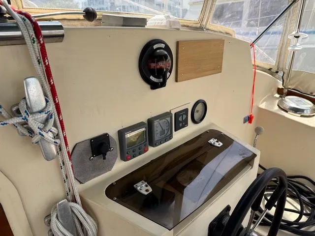 Slide: The Image of 1983 Prout 37 Snow Goose helm with navigation instruments. - 14