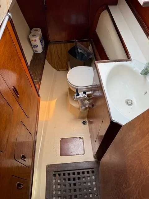 Slide: The Image of Interior of a 1983 Prout 37 Snow Goose with toilet and sink. - 17