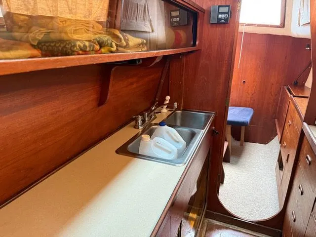 Slide: The Image of Interior of 1983 Prout 37 Snow Goose yacht with wooden cabinetry. - 20