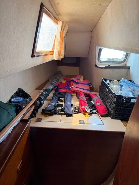 Slide: The Image of Interior of a 1983 Prout 37 Snow Goose with life jackets. - 21