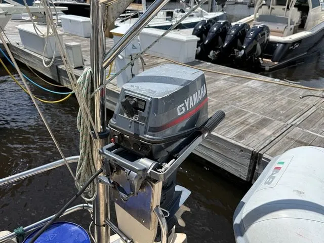 Slide: The Image of Yamaha outboard motor on Prout 37 Snow Goose, 1983, at dock. - 22