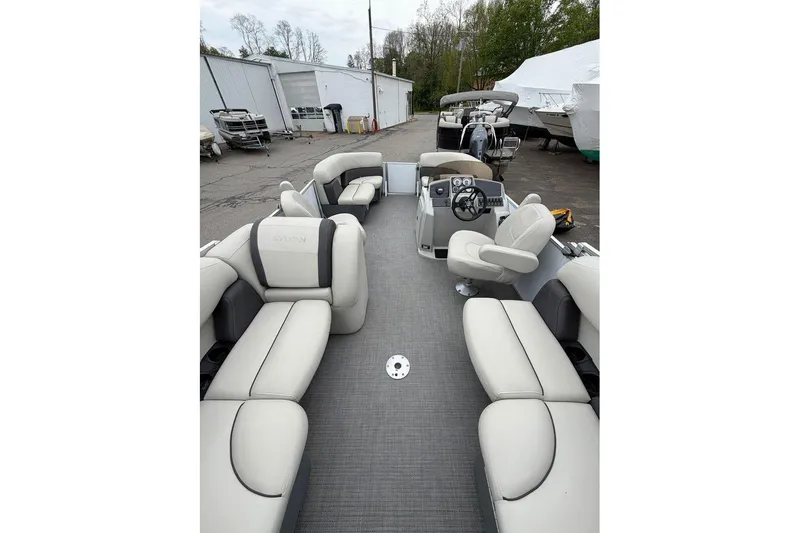 Slide: The Image of 2023 Sylvan Mirage 820 LZ pontoon boat with spacious seating and modern helm. - 10