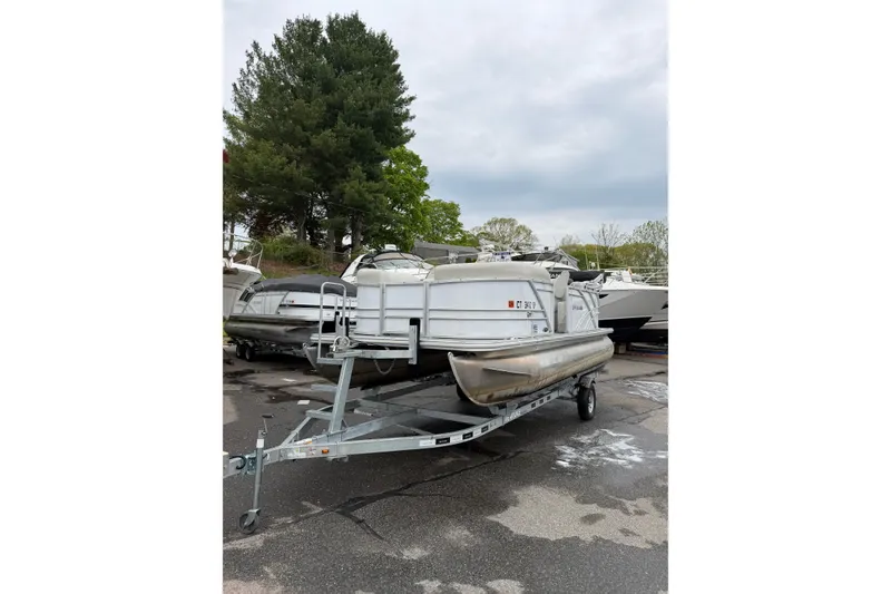 Slide: The Image of 2023 Sylvan Mirage 820 LZ pontoon boat on trailer, parked outdoors. - 3