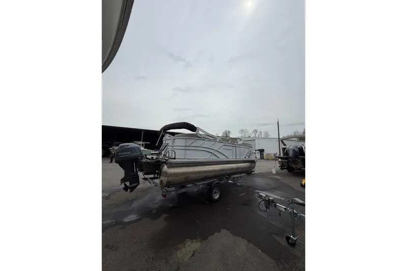 Slide: The Image of 2023 Sylvan Mirage 820 LZ pontoon boat on trailer, overcast sky background. - 5