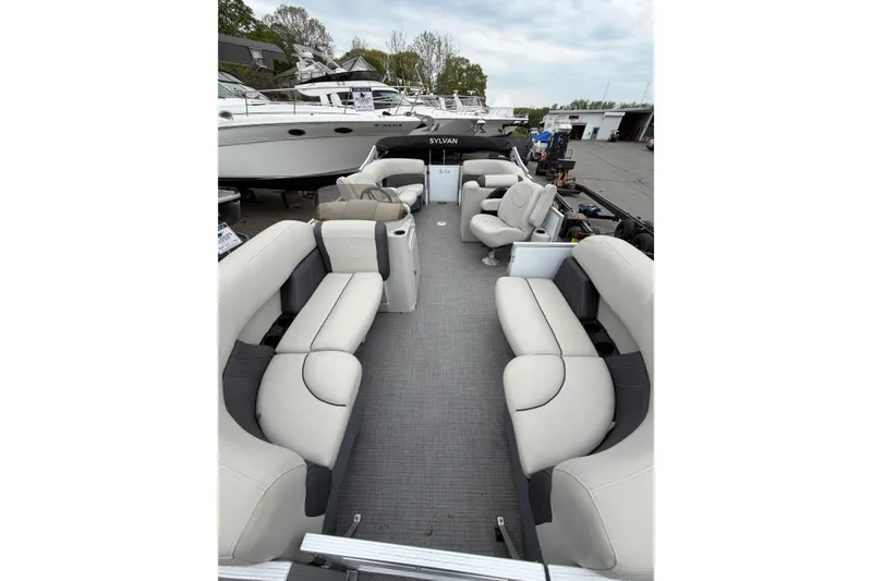 Slide: The Image of 2023 Sylvan Mirage 820 LZ pontoon boat with spacious seating and modern design. - 6