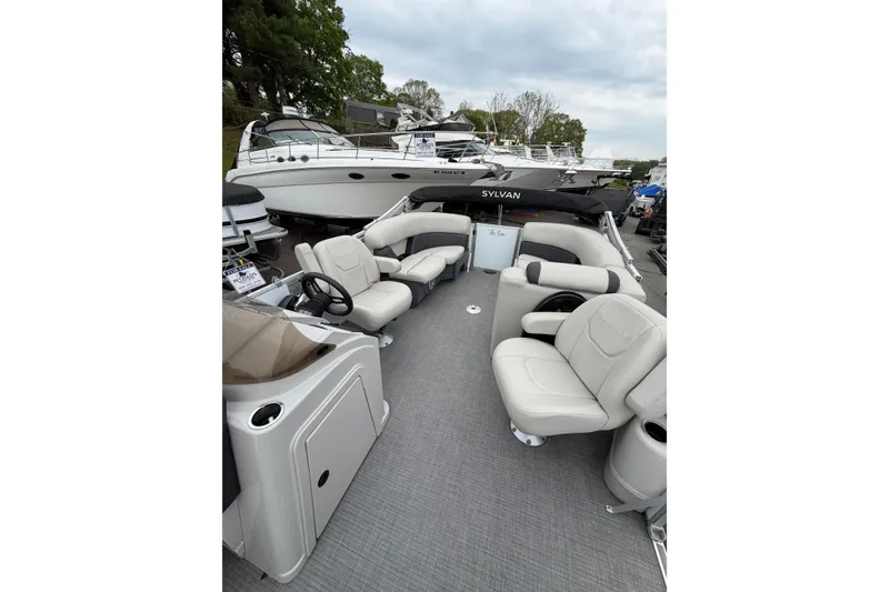 Slide: The Image of 2023 Sylvan Mirage 820 LZ pontoon boat with luxurious seating and modern design. - 9