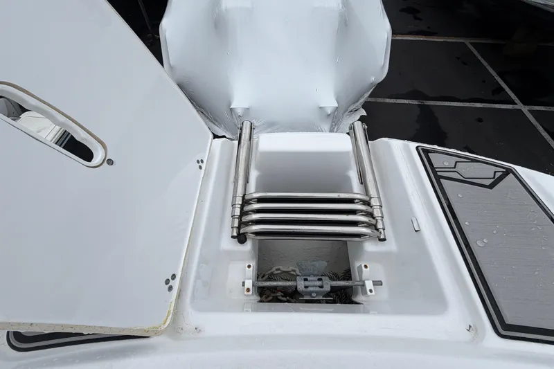 Slide: The Image of 2023 Four Winns HD5 OB boat with spacious white seating and sleek design. - 11