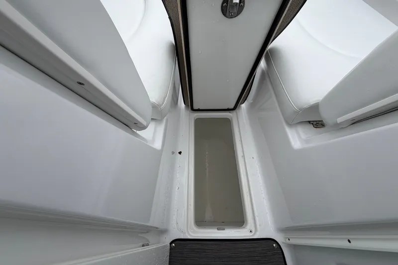 Slide: The Image of 2023 Four Winns HD5 OB boat interior with white seating and sleek dashboard design. - 13