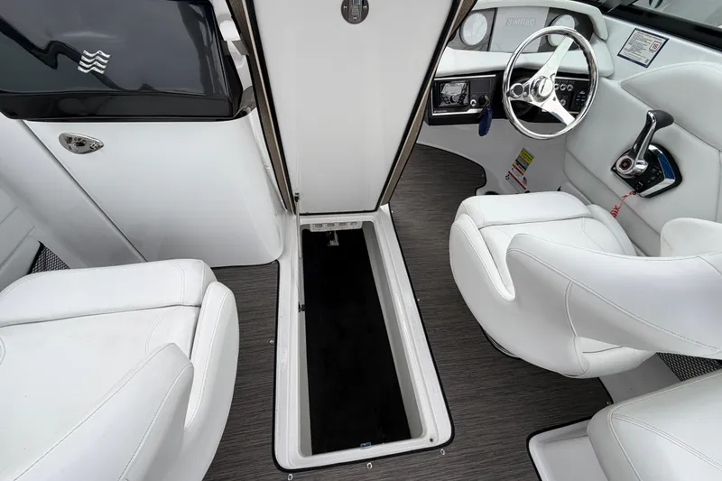 Slide: The Image of 2023 Four Winns HD5 OB boat interior with white seating and sleek design. - 14