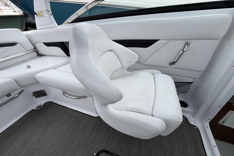 Slide: The Image of 2023 Four Winns HD5 OB boat interior with compact bathroom and sink. - 22