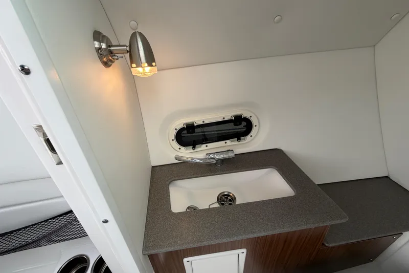 Slide: The Image of 2023 Four Winns HD5 OB boat interior with white seating and modern design. - 24