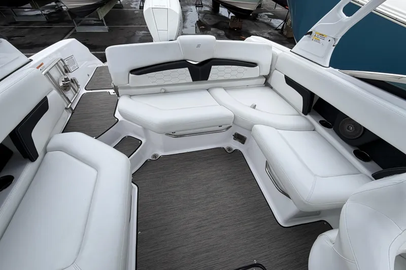 Slide: The Image of 2023 Four Winns HD5 OB boat interior with white seating and modern design. - 25