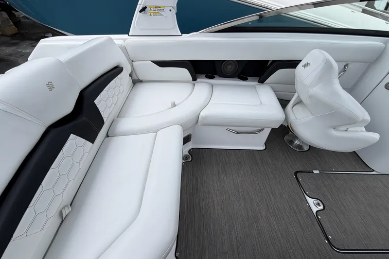 Slide: The Image of 2023 Four Winns HD5 OB boat interior with white seating and modern design. - 26