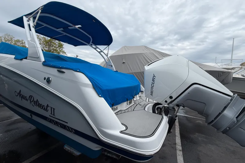 Slide: The Image of 2023 Four Winns HD5 OB boat interior with white seating and modern design. - 4