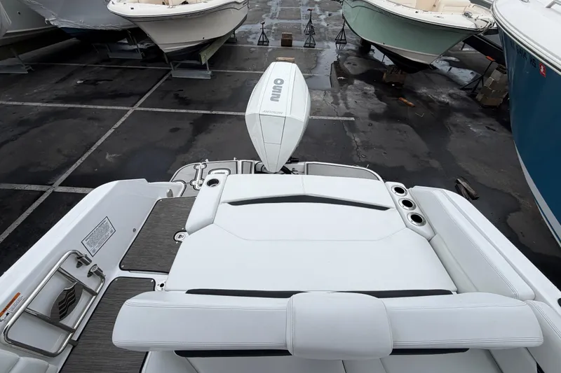 Slide: The Image of 2023 Four Winns HD5 OB boat with Mercury outboard motor in marina. - 41