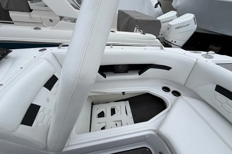 Slide: The Image of 2023 Four Winns HD5 OB boat storage compartment, open and empty. - 9