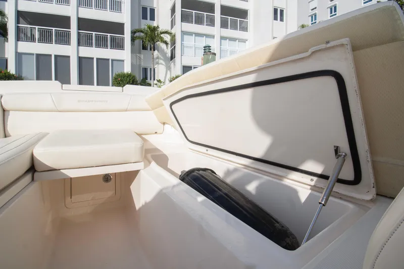 Slide: The Image of 2020 Grady-White Freedom 285 boat storage compartment open, showcasing spacious interior. - 10