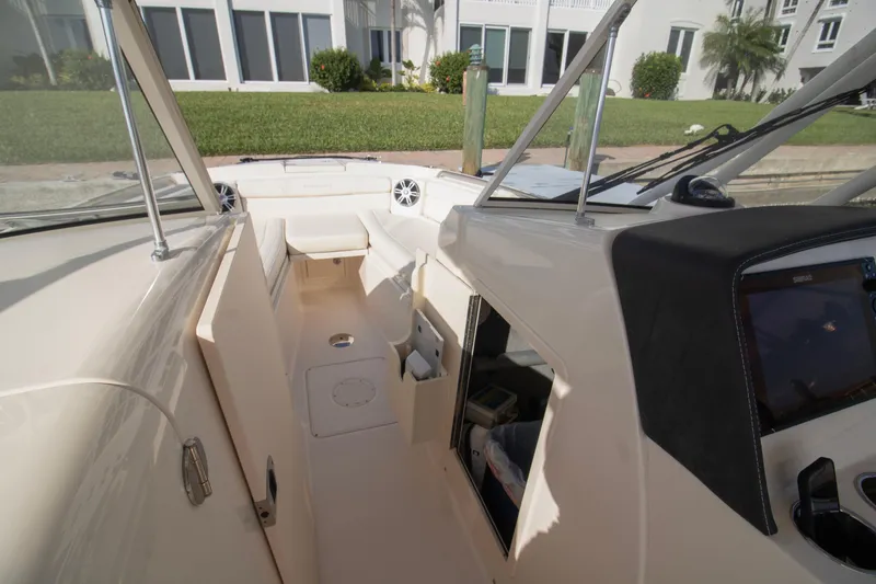 Slide: The Image of 2020 Grady-White Freedom 285 boat interior with seating and dashboard view. - 14
