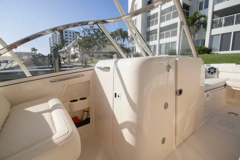 Slide: The Image of 2020 Grady-White Freedom 285 boat interior with seating and storage compartments. - 16