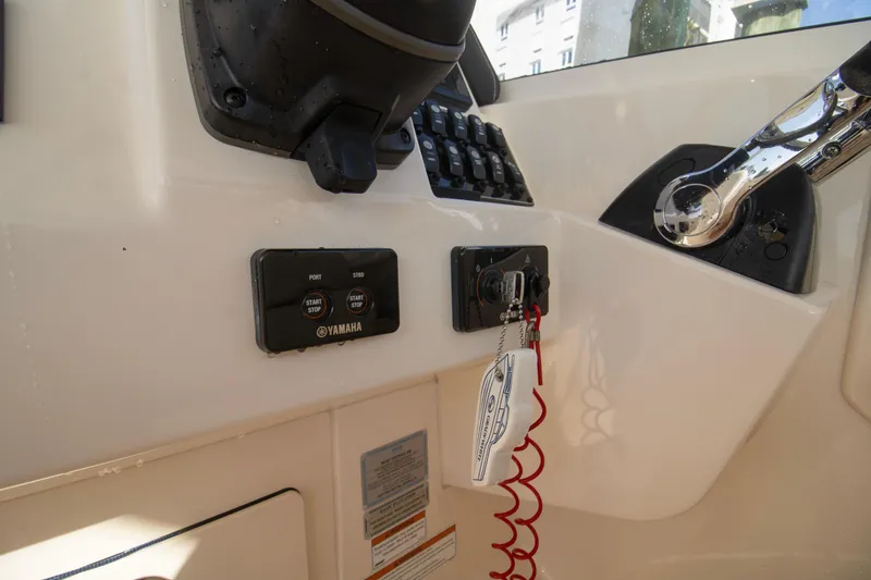 Slide: The Image of Control panel of 2020 Grady-White Freedom 285 boat with Yamaha start-stop system. - 23