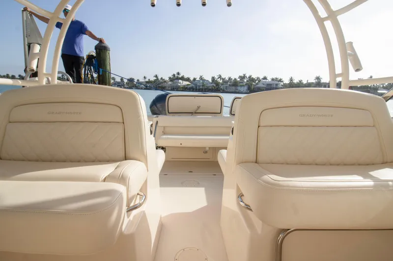 Slide: The Image of 2020 Grady-White Freedom 285 boat interior with luxurious seating and ocean view. - 24