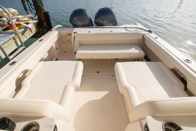 Slide: The Image of 2020 Grady-White Freedom 285 boat interior with seating and twin engines. - 29