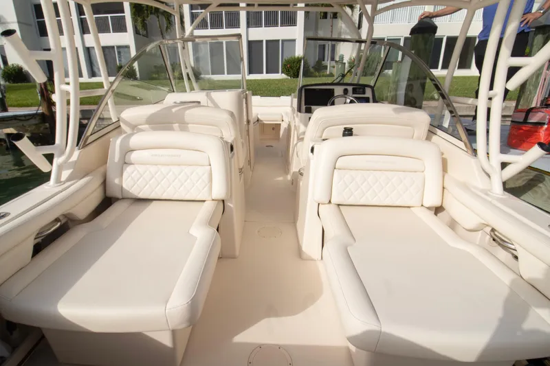 Slide: The Image of 2020 Grady-White Freedom 285 boat interior with luxurious seating and helm. - 30