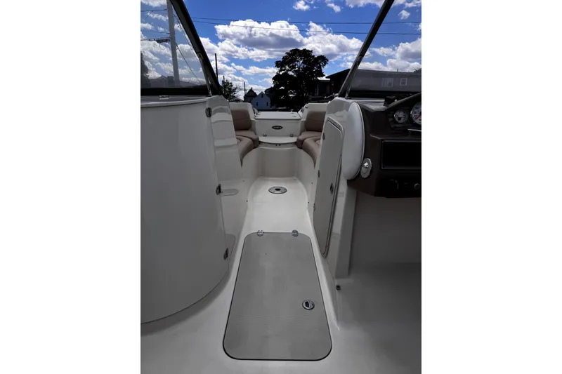 Slide: The Image of Interior view of 2015 Stingray 234 LR boat under a partly cloudy sky. - 19