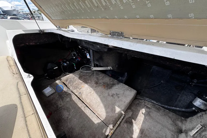 Slide: The Image of Open engine compartment of a 2015 Stingray 234 LR boat, showing interior components. - 30