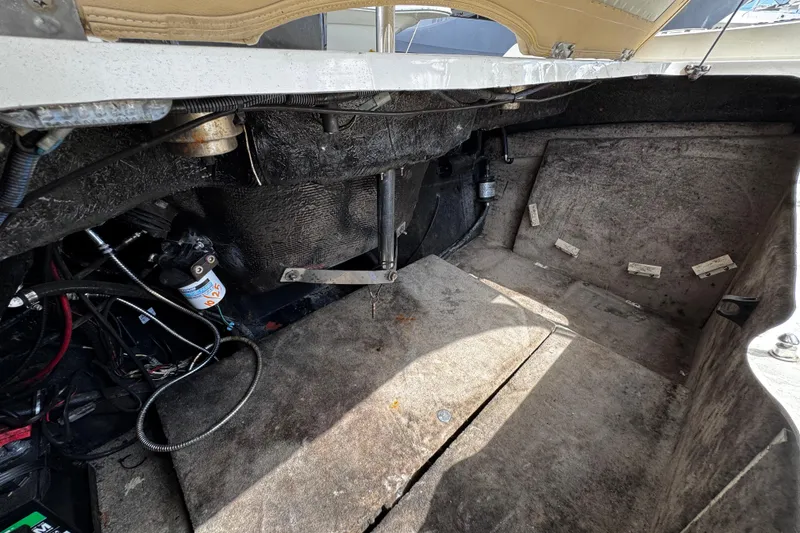 Slide: The Image of Interior view of a 2015 Stingray 234 LR boat engine compartment. - 31