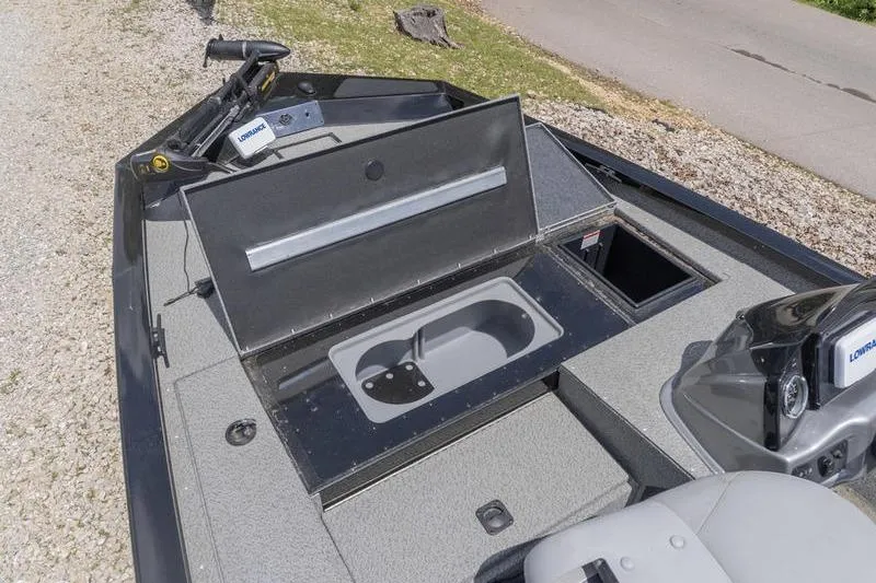 Slide: The Image of 2019 G3 Sportsman 1710 boat interior with storage compartments and seating. - 10