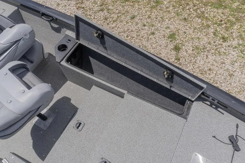 Slide: The Image of 2019 G3 Sportsman 1710 boat interior with open storage compartment and seating. - 12