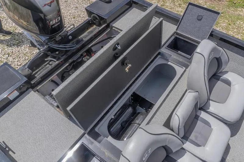 Slide: The Image of 2019 G3 Sportsman 1710 boat interior with storage compartments and seating. - 17