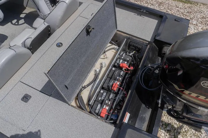 Slide: The Image of 2019 G3 Sportsman 1710 boat battery compartment with Yamaha motor, showcasing internal components. - 19