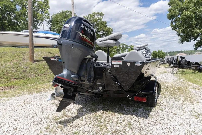 Slide: The Image of 2019 G3 Sportsman 1710 boat with Yamaha motor on gravel near lake. - 4