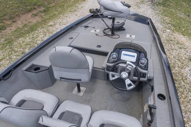 Slide: The Image of 2019 G3 Sportsman 1710 boat interior with steering wheel and seating. - 7