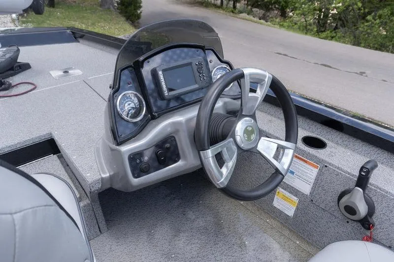 Slide: The Image of 2019 G3 Sportsman 1710 boat dashboard with steering wheel and control panel. - 8