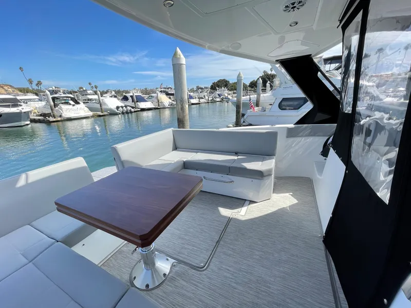 Slide: The Image of Luxurious interior of 2020 Cruisers Yachts 390 Express Coupe at marina. - 10