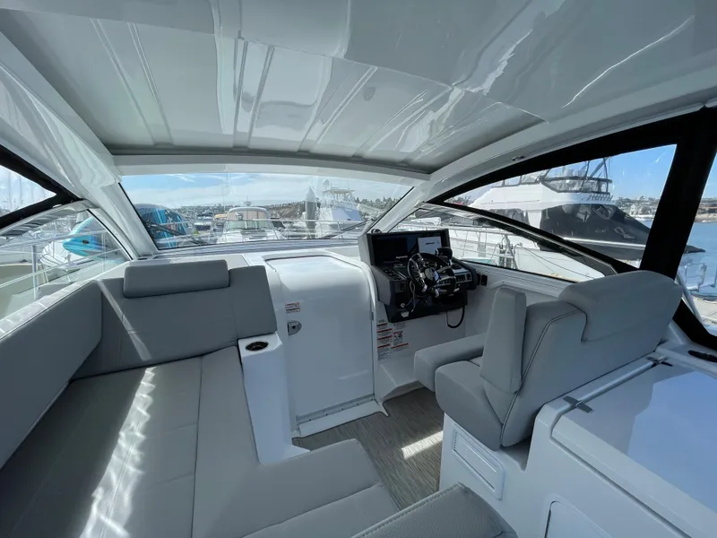 Slide: The Image of Interior of 2020 Cruisers Yachts 390 Express Coupe with gray seating. - 11