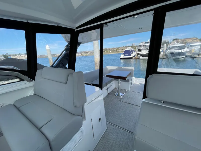 Slide: The Image of Interior of 2020 Cruisers Yachts 390 Express Coupe at the marina. - 13