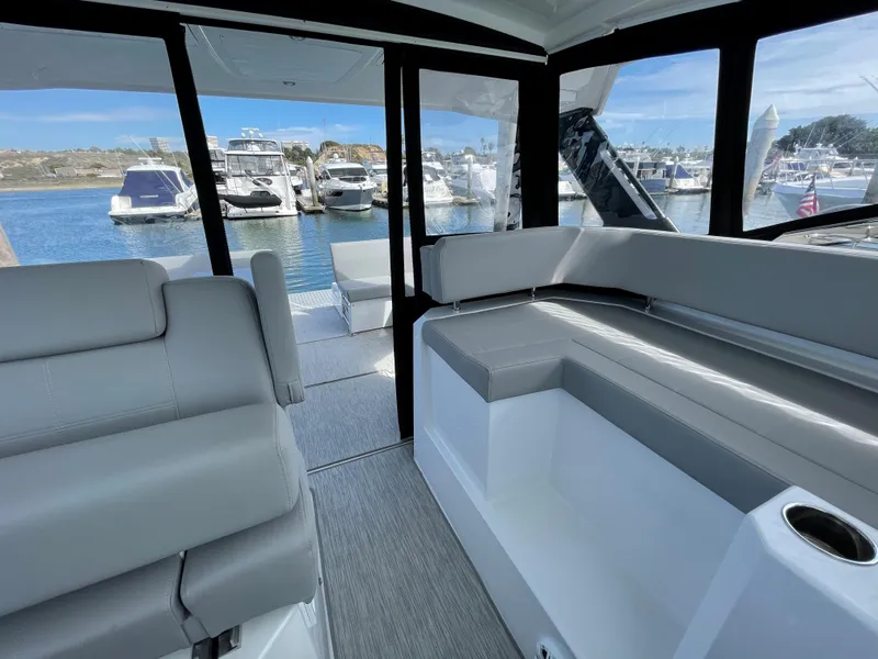 Slide: The Image of Interior of 2020 Cruisers Yachts 390 Express Coupe at marina. - 14