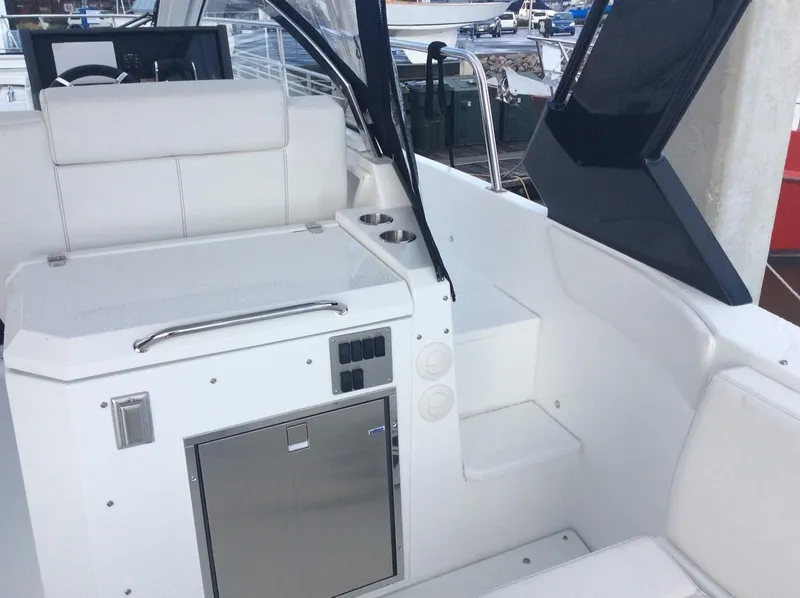 Slide: The Image of Interior of 2020 Cruisers Yachts 390 Express Coupe, white upholstery, stainless steel accents. - 19