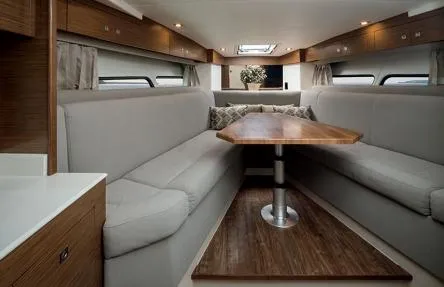 Slide: The Image of Interior of 2020 Cruisers Yachts 390 Express Coupe with elegant seating area. - 21